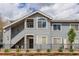 Exterior elevation of a well-maintained two-story building with private entrances at 8500 E Jefferson Ave # 3H, Denver, CO 80237