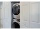 Modern, front-load washer and dryer conveniently tucked away behind closet doors at 8500 E Jefferson Ave # 3H, Denver, CO 80237