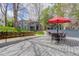 Condo community featuring an outdoor patio with table, chairs and serene views at 8500 E Jefferson Ave # 3H, Denver, CO 80237