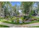 Scenic pond with surrounding greenery and townhomes creates a tranquil community atmosphere at 8500 E Jefferson Ave # 3H, Denver, CO 80237
