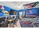 Vibrant bedroom featuring blue walls, modern lighting, and a desk area at 11833 Oak Hill Way # E, Commerce City, CO 80640