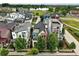 Aerial view of a neighborhood, showcasing the home's location near a pond and green spaces at 1376 Snowberry Ln, Louisville, CO 80027