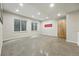 Finished basement with polished concrete floors and natural light from egress windows at 1376 Snowberry Ln, Louisville, CO 80027