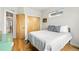 Cozy bedroom with hardwood floors, closet space, and a bright window at 1376 Snowberry Ln, Louisville, CO 80027