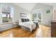 Bright bedroom with hardwood floors and large windows providing ample natural light at 1376 Snowberry Ln, Louisville, CO 80027