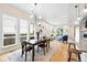 Open dining area with modern lighting and large windows offering plenty of natural light at 1376 Snowberry Ln, Louisville, CO 80027
