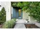 Inviting front door with plants, a modern design, and a well-lit entrance at 1376 Snowberry Ln, Louisville, CO 80027