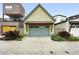 Two car garage with updated overhead door and landscaping at 1376 Snowberry Ln, Louisville, CO 80027