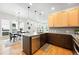 Modern kitchen with stainless steel appliances, two-tone cabinetry, and quartz countertops at 1376 Snowberry Ln, Louisville, CO 80027