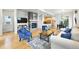 Bright living room with a modern fireplace, hardwood floors, and comfortable seating at 1376 Snowberry Ln, Louisville, CO 80027