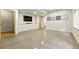 Spacious living room with stained concrete floors, recessed lights, and modern wall decor at 1376 Snowberry Ln, Louisville, CO 80027