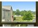 Stunning window view overlooking a lake, a lush green lawn, and a neighborhood landscape at 1376 Snowberry Ln, Louisville, CO 80027