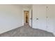 Empty bedroom showcasing access to an ensuite bath and a spacious closet at 7822 S Kittredge Cir, Englewood, CO 80112