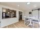 Open dining area showcasing sliding barn doors and views into the living room at 7822 S Kittredge Cir, Englewood, CO 80112
