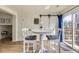 Inviting dining area featuring a round table, chairs, and a sliding glass door to the yard at 7822 S Kittredge Cir, Englewood, CO 80112