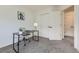 Bright office space featuring a modern desk and access to a closet and ensuite at 7822 S Kittredge Cir, Englewood, CO 80112