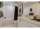 Bright bathroom featuring white subway tile in shower and vanity with modern fixtures at 3500 S Corona St # 205, Englewood, CO 80113