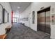 Well-lit hallway with elevator access and contemporary decor at 3500 S Corona St # 205, Englewood, CO 80113