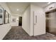 Modern hallway with elevator and unit access at 3500 S Corona St # 205, Englewood, CO 80113