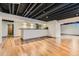 Spacious finished basement with exposed ceiling and bar area at 8075 S Harrison Way, Centennial, CO 80122