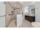 Stylish bathroom featuring a glass-enclosed shower and a dark vanity with double sinks at 8075 S Harrison Way, Centennial, CO 80122