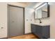 Contemporary bathroom with gray vanity and stylish sink at 8075 S Harrison Way, Centennial, CO 80122