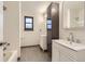 Bright bathroom featuring a vanity with double sinks, tile flooring and modern fixtures at 8075 S Harrison Way, Centennial, CO 80122