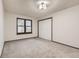 Carpeted bedroom featuring a window and a closet with white bi-fold doors at 8075 S Harrison Way, Centennial, CO 80122