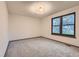 Neutral bedroom featuring a window and carpeted floors at 8075 S Harrison Way, Centennial, CO 80122