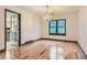 Dining room features hardwood floors, elegant chandelier, and ample natural light at 8075 S Harrison Way, Centennial, CO 80122