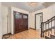Beautiful foyer with hardwood floors, stunning front door, chandelier and staircase at 8075 S Harrison Way, Centennial, CO 80122