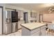 Modern kitchen equipped with stainless steel refrigerator and island, perfect for Gathering gatherings at 8075 S Harrison Way, Centennial, CO 80122