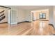 Expansive living space featuring beautiful hardwood floors, bright lighting, and classic trim at 8075 S Harrison Way, Centennial, CO 80122