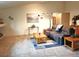 Spacious living room featuring plush carpeting, comfortable seating, and natural light at 5860 W 115Th Ave, Westminster, CO 80020