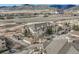 Scenic condo community with garages, greenery, and mountain views at 9568 W San Juan Cir # 203, Littleton, CO 80128