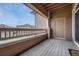 Covered balcony providing a private outdoor space with views of the surrounding neighborhood at 9568 W San Juan Cir # 203, Littleton, CO 80128