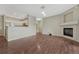 A spacious living area offering a fireplace, hardwood floors, and an open layout to the kitchen at 9568 W San Juan Cir # 203, Littleton, CO 80128