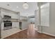 View of the kitchen leading into the living room and dining space at 9568 W San Juan Cir # 203, Littleton, CO 80128