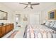Comfortable bedroom featuring a decorative blanket and dresser at 2027 S Welch Cir, Lakewood, CO 80228
