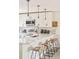 Well-appointed kitchen featuring a quartz countertop, pendant lighting, and stainless steel appliances at 2027 S Welch Cir, Lakewood, CO 80228