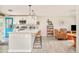 Modern kitchen featuring a center island with seating, stainless steel appliances, and an open layout at 2027 S Welch Cir, Lakewood, CO 80228