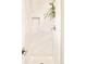 Bright shower with white tile, brushed nickel hardware and built-in shelf provides a clean and modern aesthetic at 2027 S Welch Cir, Lakewood, CO 80228