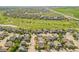 Aerial view of single Gathering homes in a well-manicured neighborhood adjacent to a golf course at 1404 Tonkin Pl, Longmont, CO 80504