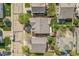 Aerial view of a home surrounded by lush landscaping in a suburban neighborhood at 1404 Tonkin Pl, Longmont, CO 80504