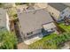 Aerial view showcasing a backyard with a stone patio and wooden deck with awning at 1404 Tonkin Pl, Longmont, CO 80504