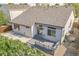 Backyard showcasing a wooden deck, stone patio, and well-maintained landscaping at 1404 Tonkin Pl, Longmont, CO 80504
