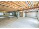 Unfinished basement with exposed ceiling beams and concrete floor, ready to be transformed at 1404 Tonkin Pl, Longmont, CO 80504