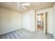 Cozy bedroom features a ceiling fan, neutral walls, and plush carpet at 1404 Tonkin Pl, Longmont, CO 80504