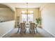 Elegant dining room with arched entryways, chandelier lighting, and large windows at 1404 Tonkin Pl, Longmont, CO 80504