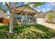 Home with welcoming porch, large windows, and a well-kept front lawn at 1404 Tonkin Pl, Longmont, CO 80504